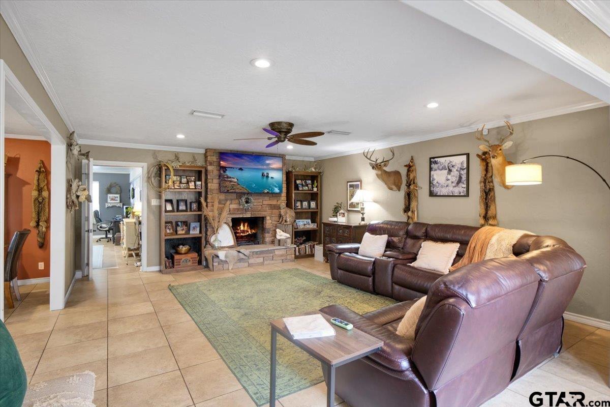 906 Zola Street Quitman, TX 75783 - Photo 15 of 41 a living room with furniture and a flat screen tv