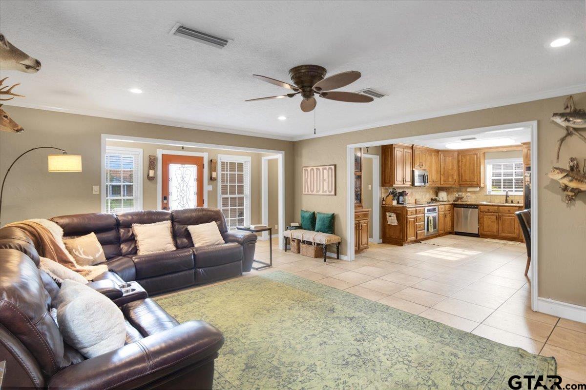 906 Zola Street Quitman, TX 75783 - Photo 17 of 41 a living room with furniture and a large window