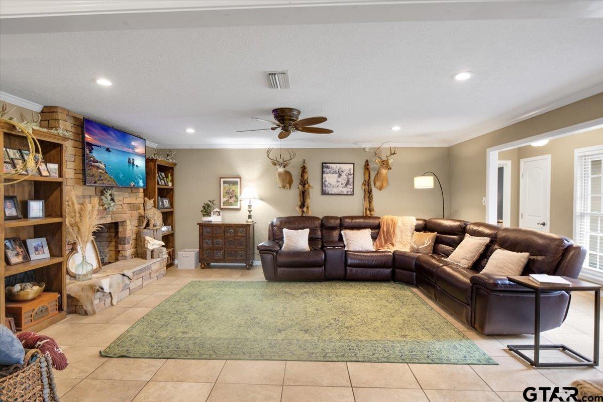 906 Zola Street Quitman, TX 75783 - Photo 18 of 41 a living room with furniture and a book shelf