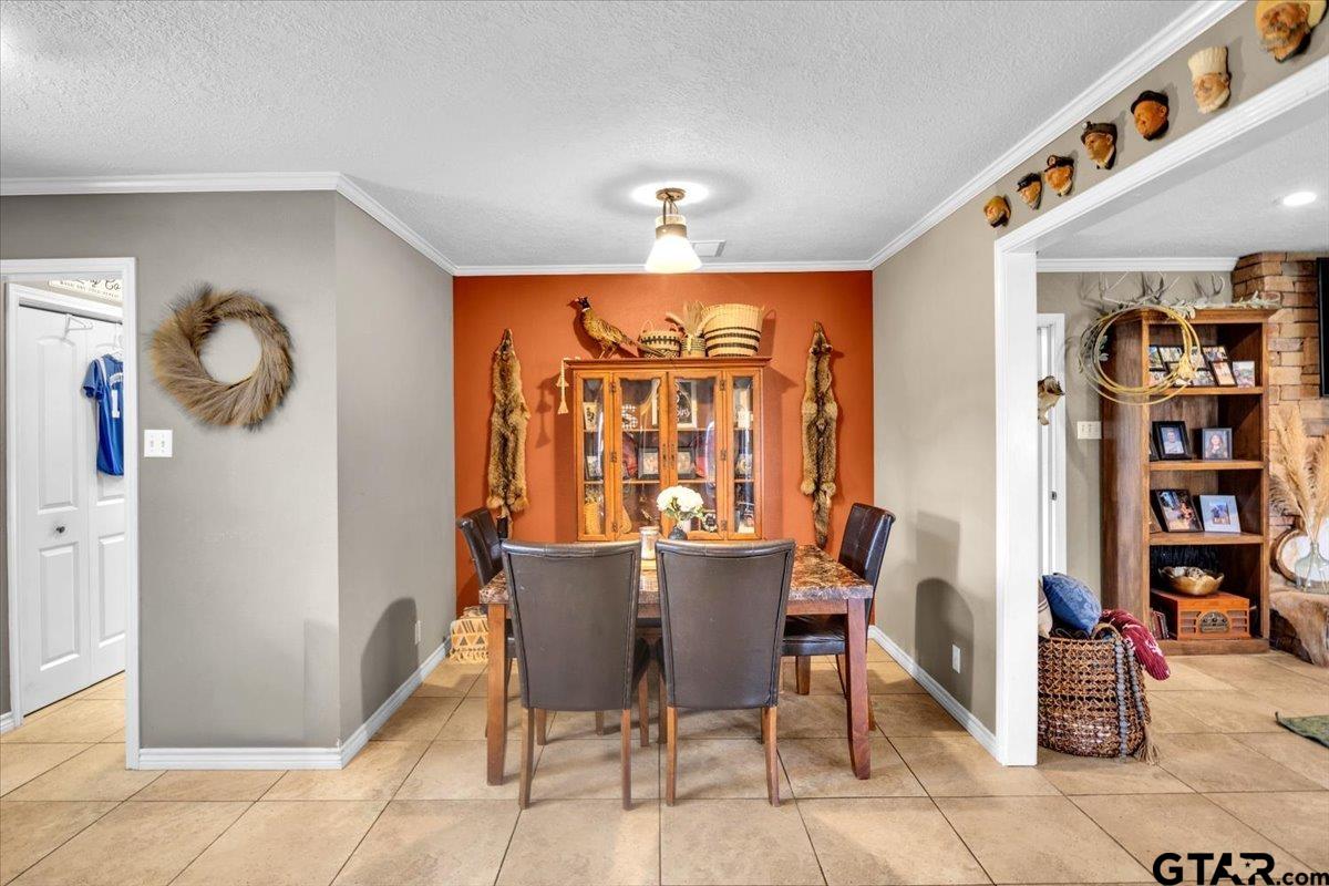 906 Zola Street Quitman, TX 75783 - Photo 21 of 41 a dining room with furniture and window