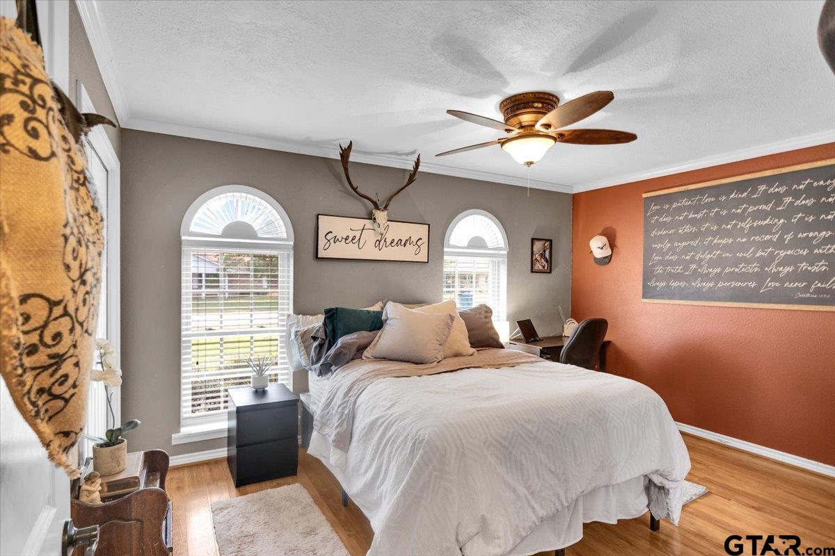 906 Zola Street Quitman, TX 75783 - Photo 23 of 41 a bedroom with a large bed and a window