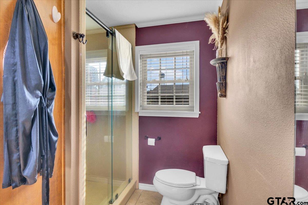 906 Zola Street Quitman, TX 75783 - Photo 28 of 41 a bathroom with a toilet sink and shower