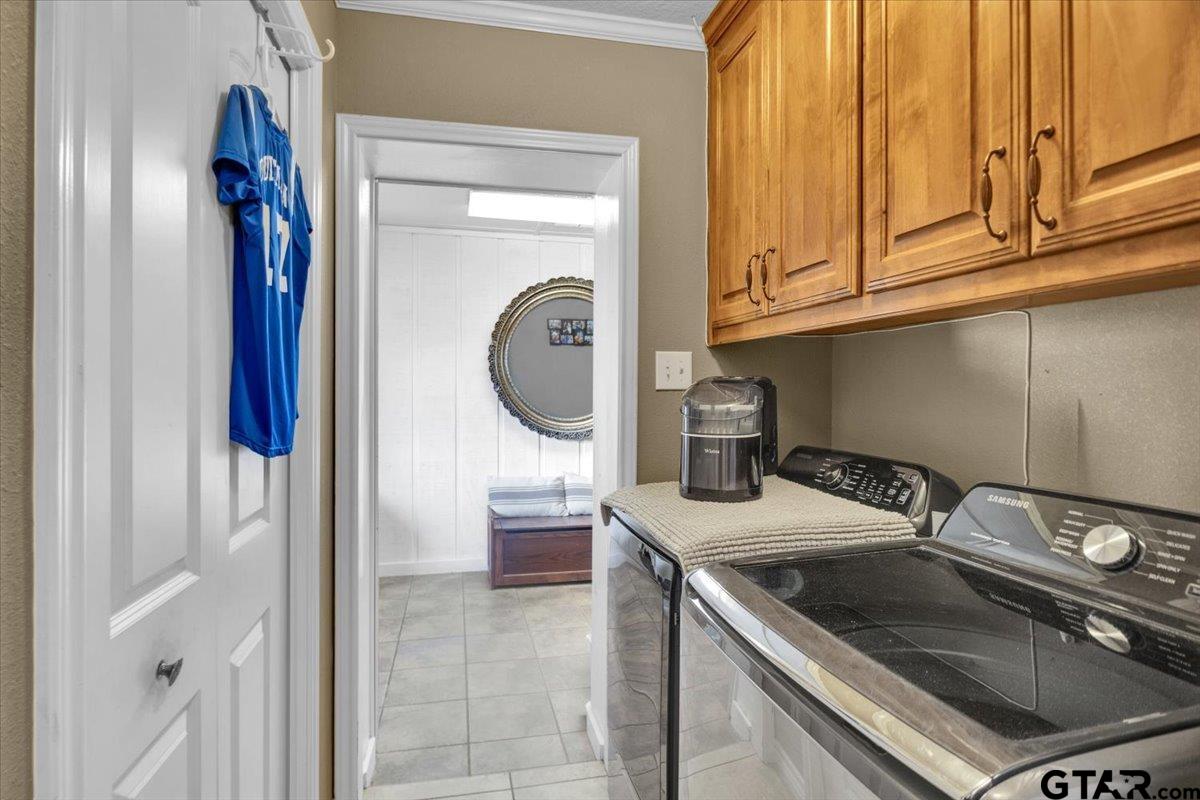 906 Zola Street Quitman, TX 75783 - Photo 29 of 41 a kitchen with a sink and a stove top oven