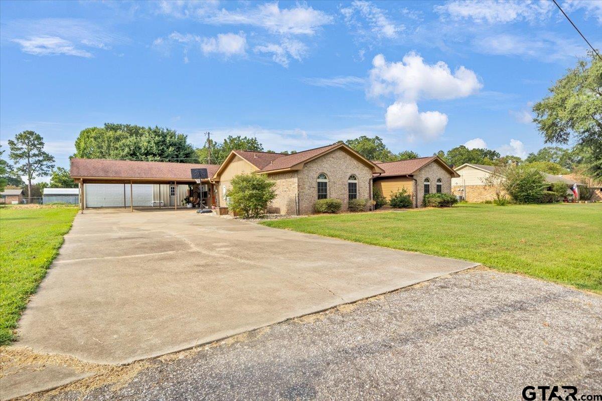906 Zola Street Quitman, TX 75783 - Photo 3 of 41 a view of house with outdoor space and parking
