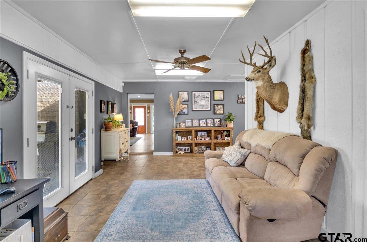 906 Zola Street Quitman, TX 75783 - Photo 33 of 41 a living room with furniture and wooden floor