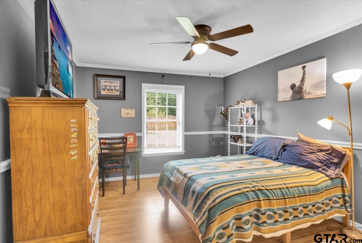 906 Zola Street Quitman, TX 75783 - Photo 39 of 41 a bedroom with a bed and a table with chair