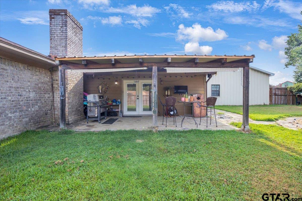 906 Zola Street Quitman, TX 75783 - Photo 5 of 41 a view of a porch and patio with a yard