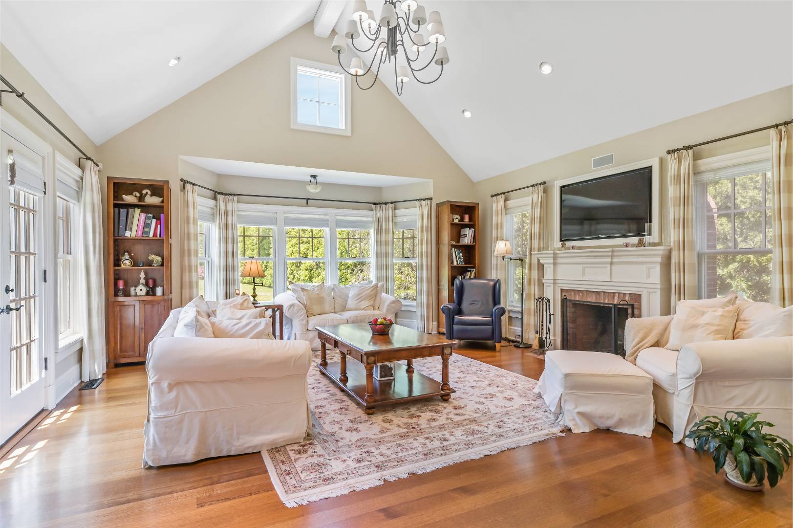 15 Dock Road Remsenburg, NY 11960 - Photo 11 of 34 a living room with fireplace furniture and a flat screen tv