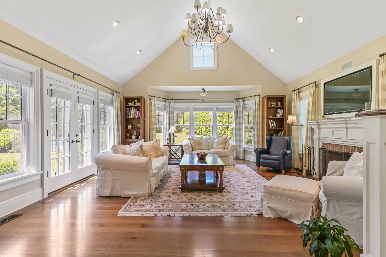 15 Dock Road Remsenburg, NY 11960 - Photo 12 of 34 a living room with fireplace furniture and a large window