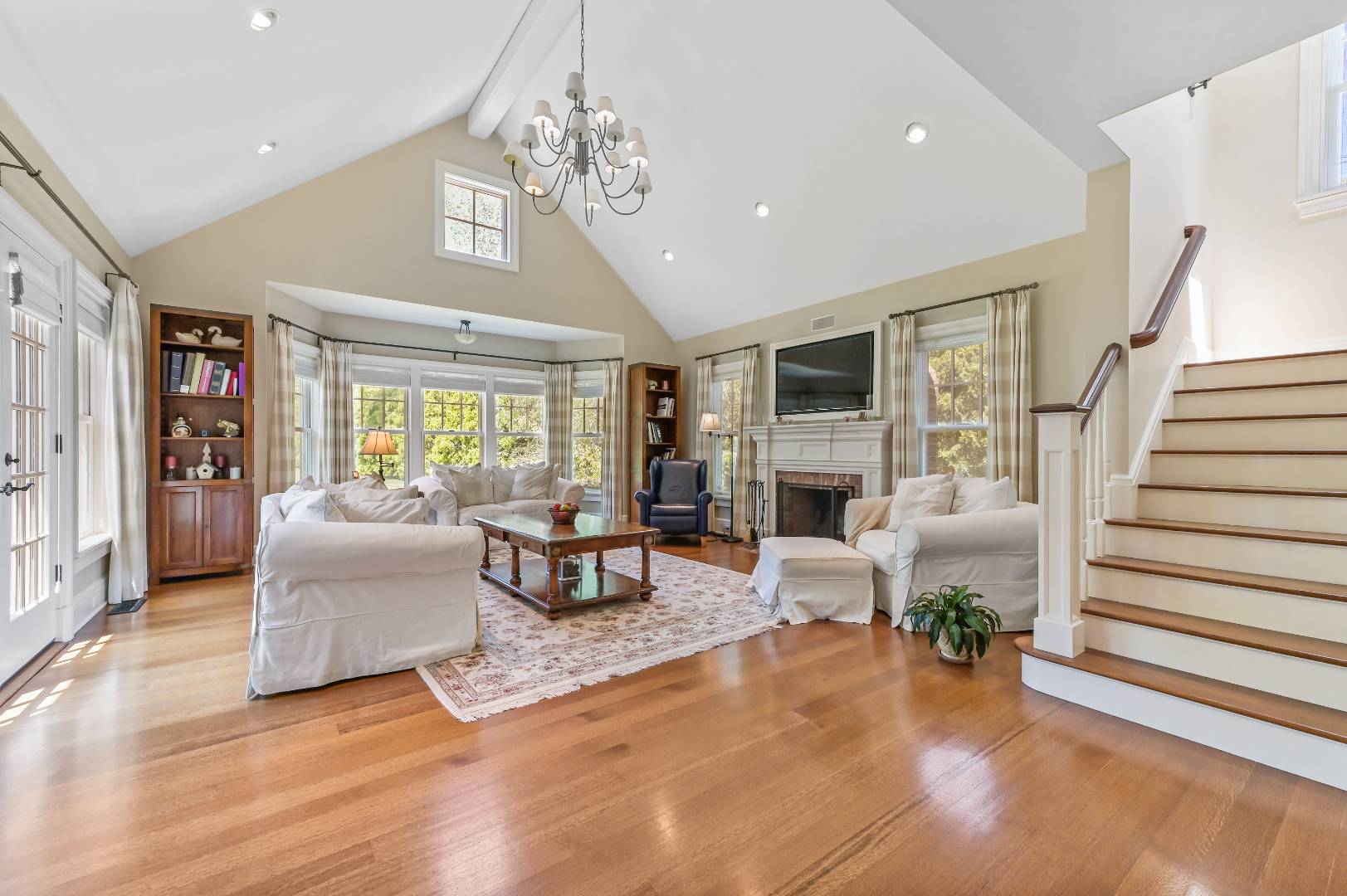 15 Dock Road Remsenburg, NY 11960 - Photo 15 of 34 a living room with furniture and a fireplace