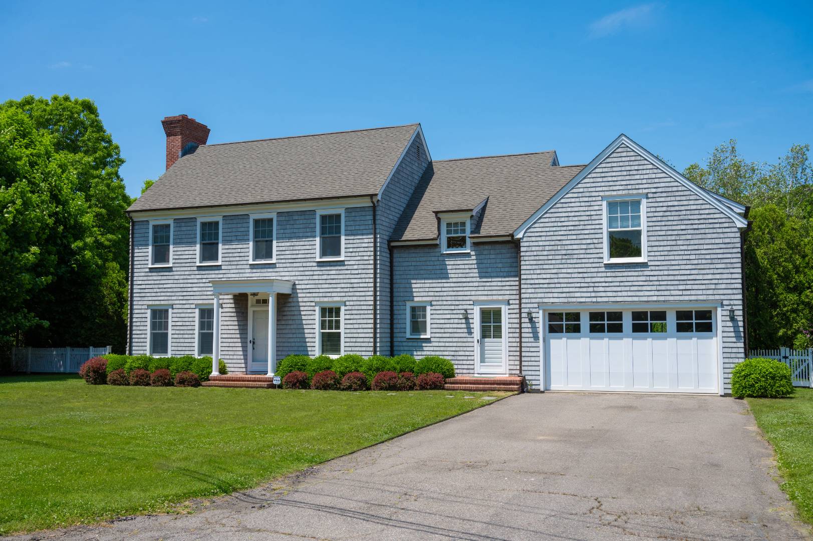 15 Dock Road Remsenburg, NY 11960 - Photo 3 of 34 a front view of a house with a yard