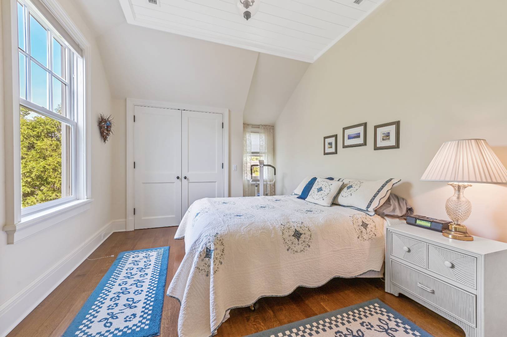 15 Dock Road Remsenburg, NY 11960 - Photo 21 of 34 a bedroom with a bed and a window