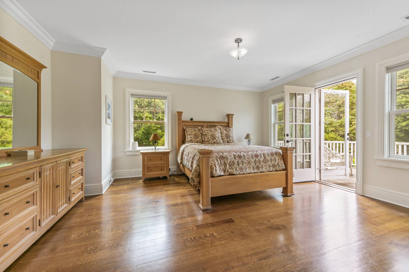 15 Dock Road Remsenburg, NY 11960 - Photo 26 of 34 a bedroom with a bed and a large window