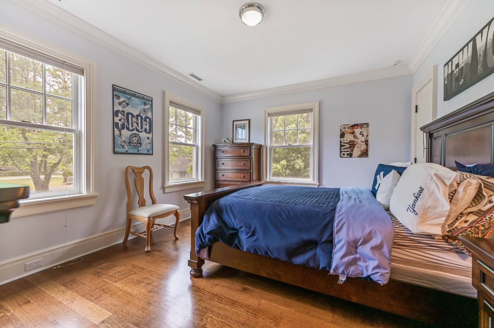 15 Dock Road Remsenburg, NY 11960 - Photo 29 of 34 a bedroom with a bed and wooden floor