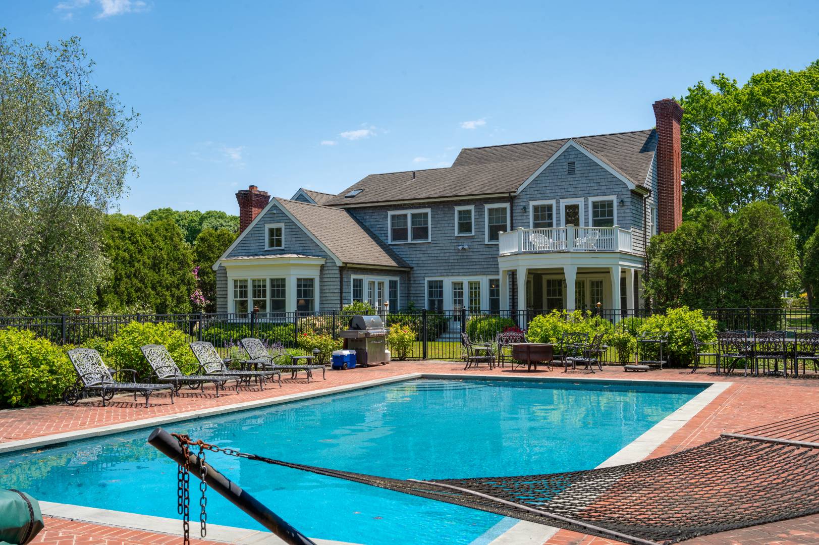 15 Dock Road Remsenburg, NY 11960 - Photo 33 of 34 a front view of a house with swimming pool having outdoor seating