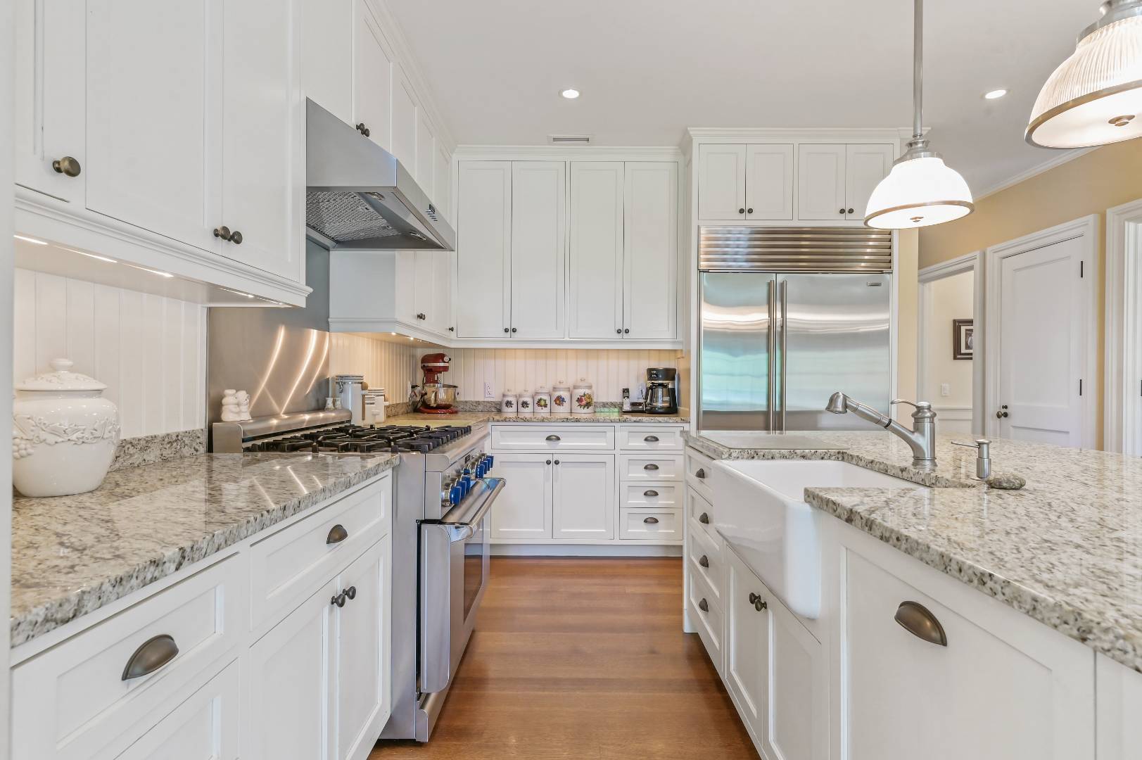 15 Dock Road Remsenburg, NY 11960 - Photo 8 of 34 a kitchen with granite countertop a sink stove and cabinets