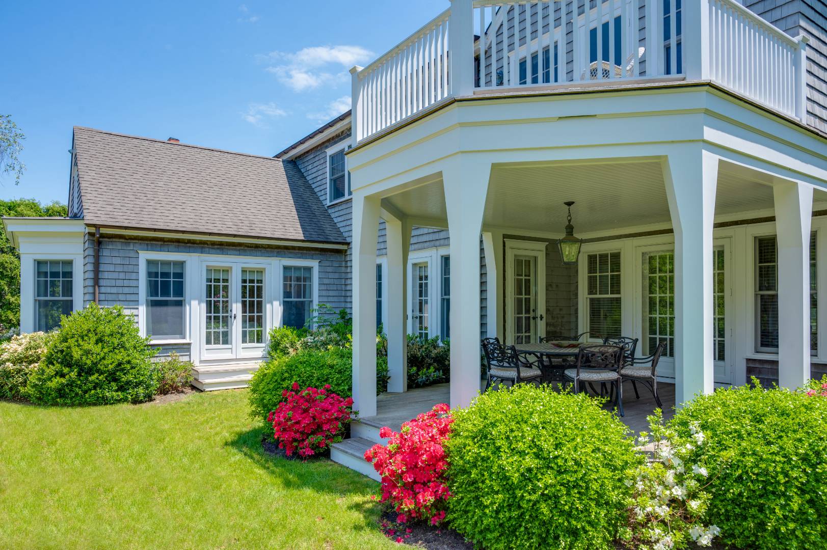 15 Dock Road Remsenburg, NY 11960 - Photo 10 of 34 a front view of a house with a yard and fountain