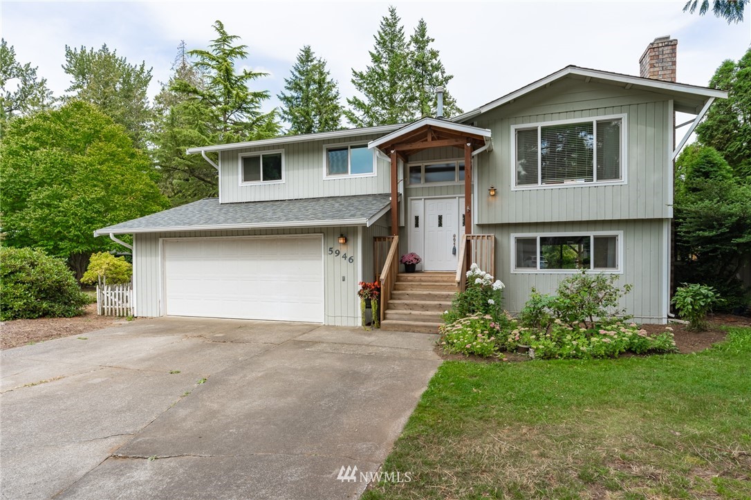 5946 Longdin Road Ferndale, WA 98248 - Photo 1 of 40 a front view of a house with a yard and garage