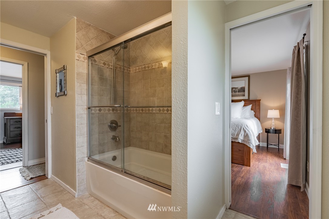 5946 Longdin Road Ferndale, WA 98248 - Photo 14 of 40 a en suite bathroom with a tub and shower