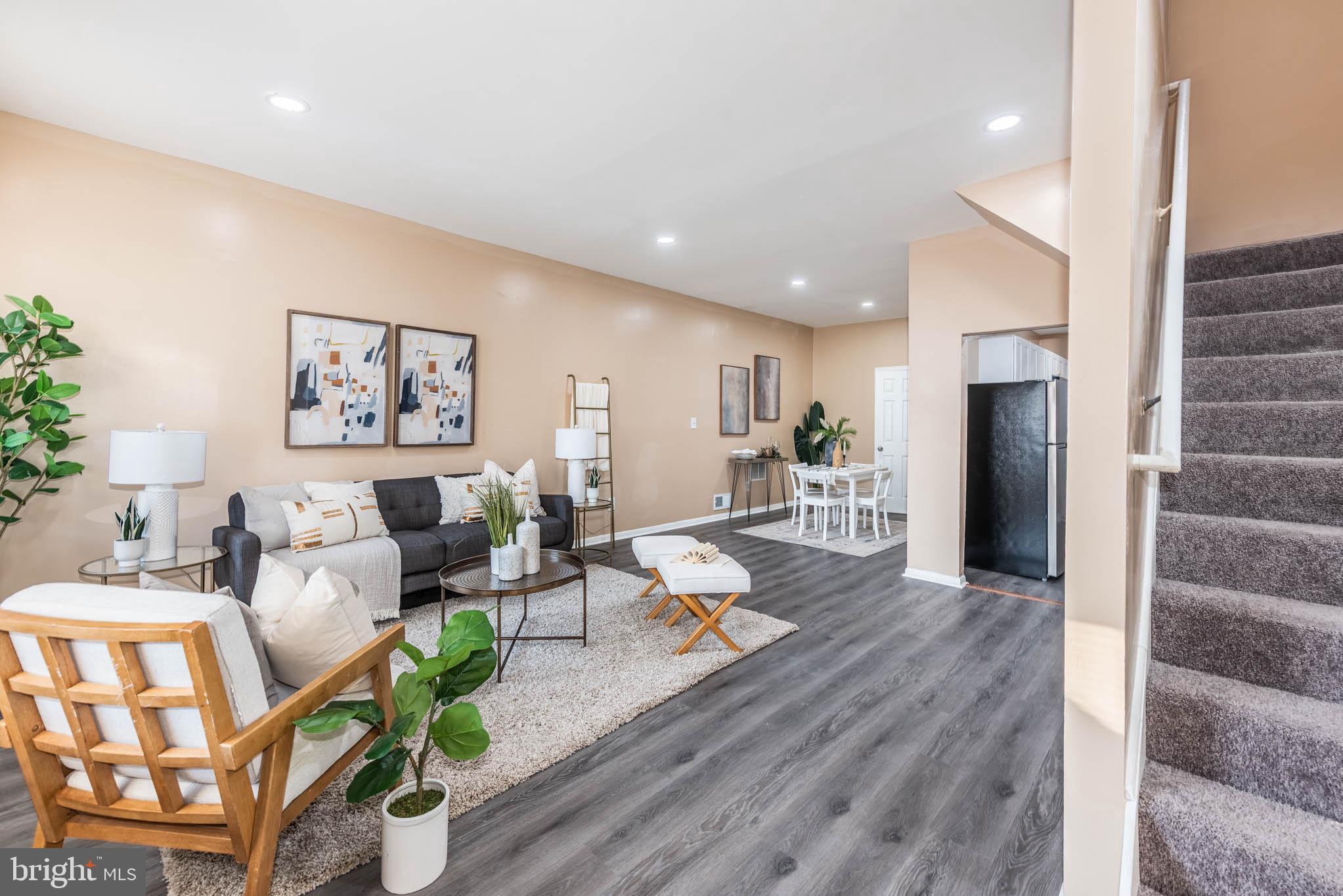 1705 East 25th Street Baltimore, MD 21213 - Photo 1 of 21 a living room with furniture and wooden floor