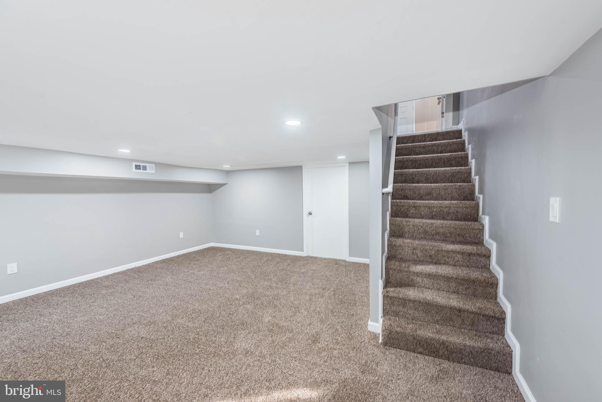 1705 East 25th Street Baltimore, MD 21213 - Photo 18 of 21 a view of an empty room with stairs