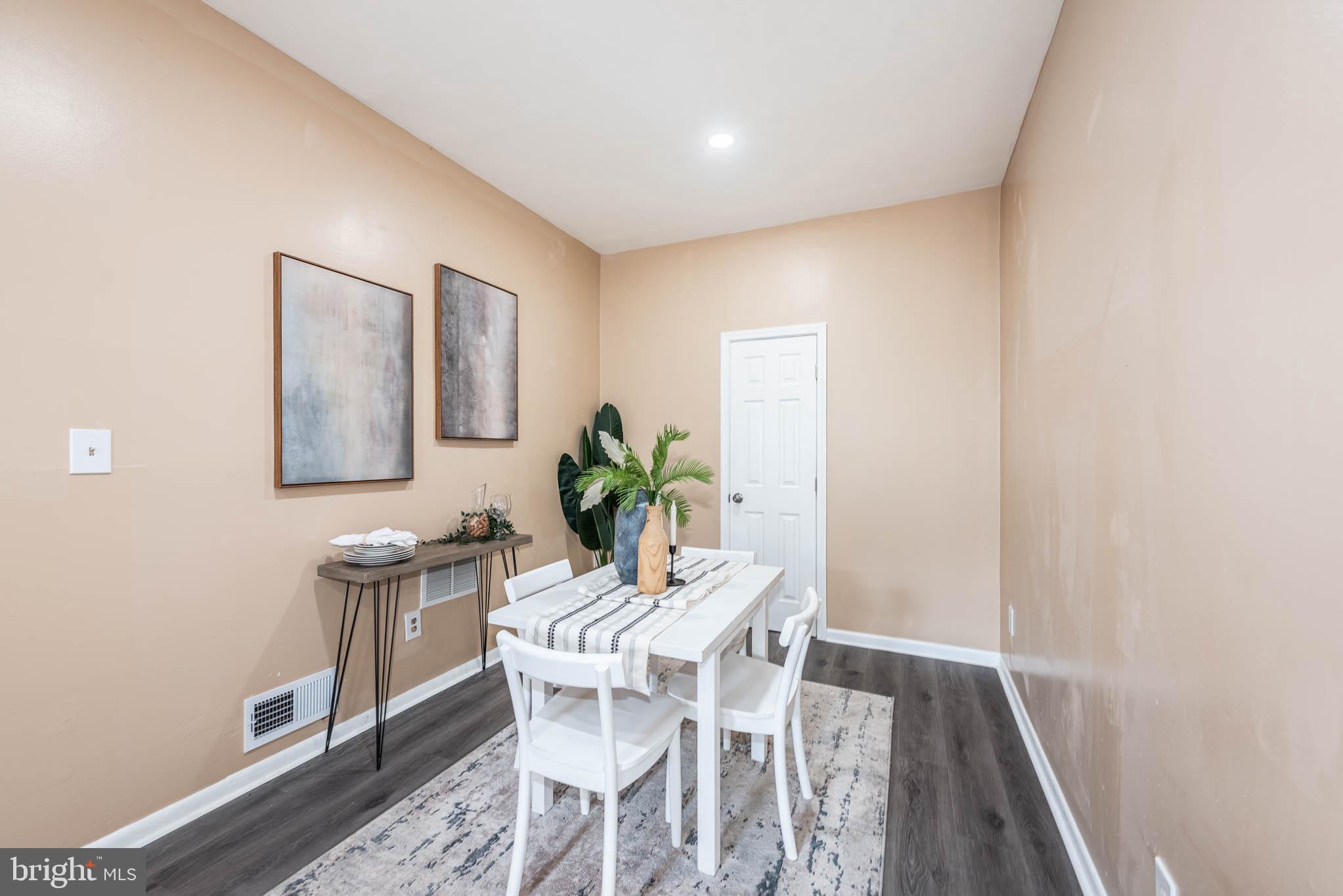 1705 East 25th Street Baltimore, MD 21213 - Photo 5 of 21 a dining room with furniture and window