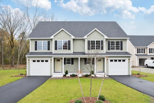 a front view of a house with swimming pool and porch