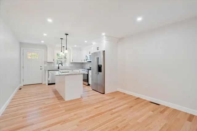 a view of kitchen with wooden floor