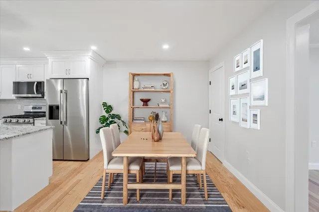 a kitchen with stainless steel appliances a stove a refrigerator and a refrigerator