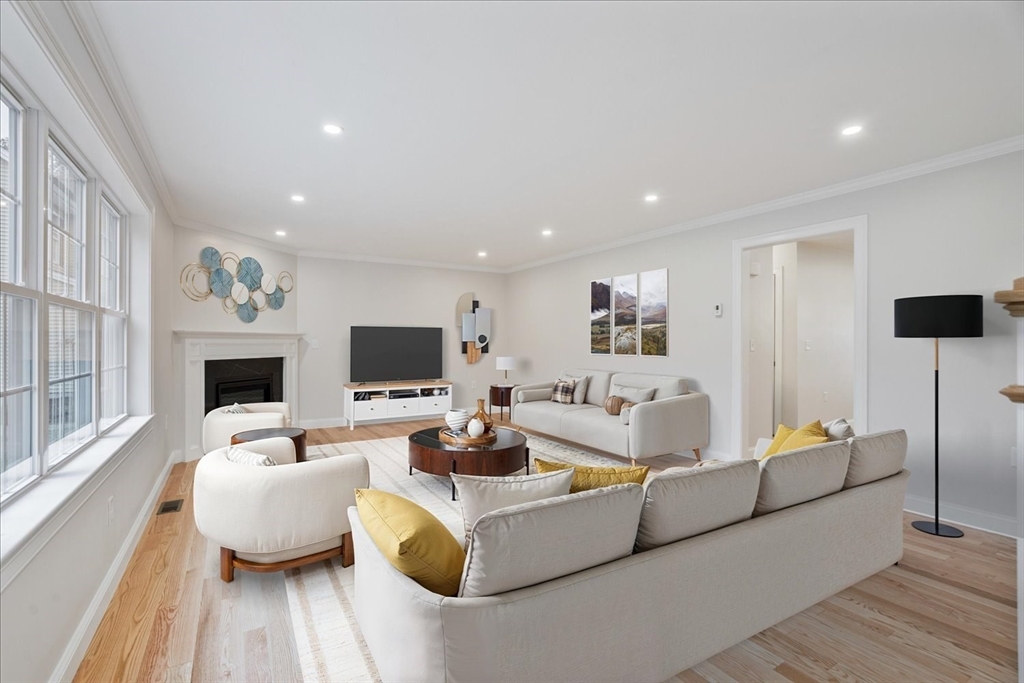 515 Mendon Road, Unit 515 Attleboro, MA 02703 - Photo 18 of 33 a living room with furniture and a flat screen tv
