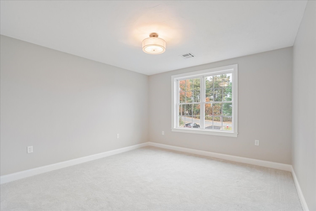 515 Mendon Road, Unit 515 Attleboro, MA 02703 - Photo 23 of 33 an empty room with a window