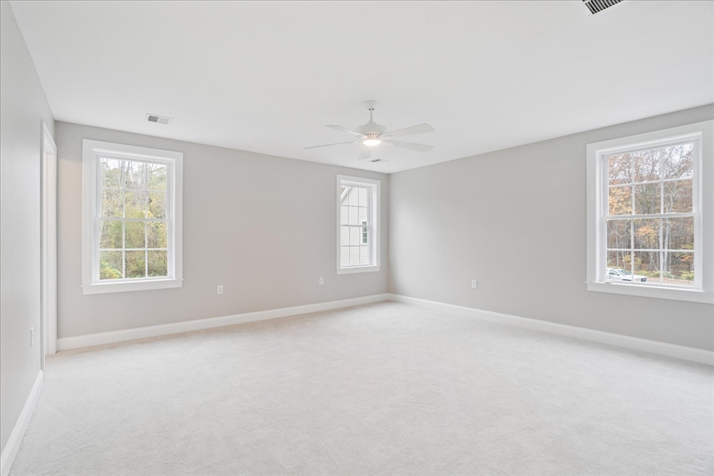 515 Mendon Road, Unit 515 Attleboro, MA 02703 - Photo 26 of 33 an empty room with windows and closet