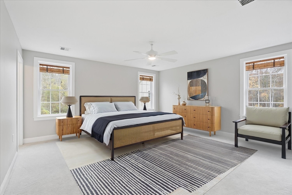 515 Mendon Road, Unit 515 Attleboro, MA 02703 - Photo 27 of 33 a bed room with a bed and a chair