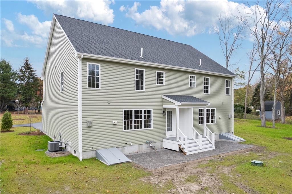 515 Mendon Road, Unit 515 Attleboro, MA 02703 - Photo 8 of 33 a front view of a house with a yard