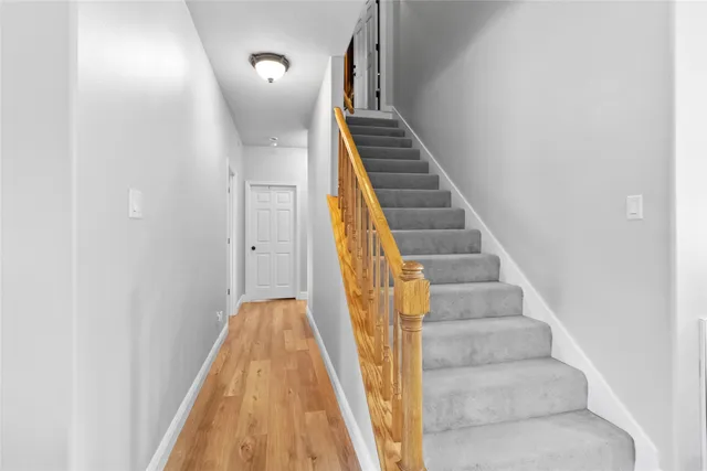 a view of staircase with white walls