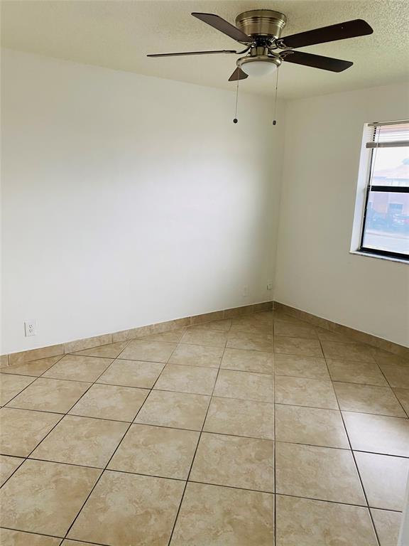 10046 Winding Lake Road, Unit 203 Sunrise, FL 33351 - Photo 13 of 31 a view of a room and window