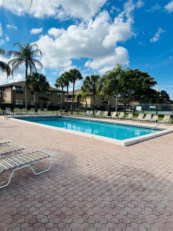 10046 Winding Lake Road, Unit 203 Sunrise, FL 33351 - Photo 20 of 31 a view of a entertaining space and houses