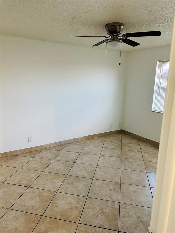 10046 Winding Lake Road, Unit 203 Sunrise, FL 33351 - Photo 23 of 31 a view of a room with racks on the wall