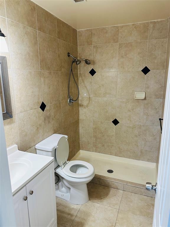 10046 Winding Lake Road, Unit 203 Sunrise, FL 33351 - Photo 25 of 31 a bathroom with a toilet and a shower