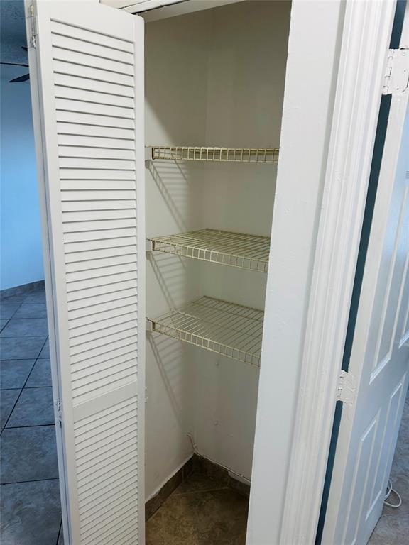 10046 Winding Lake Road, Unit 203 Sunrise, FL 33351 - Photo 27 of 31 a bathroom with a glass door shower and a sink