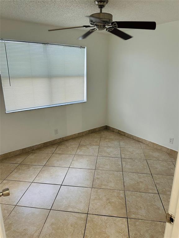10046 Winding Lake Road, Unit 203 Sunrise, FL 33351 - Photo 28 of 31 a view of a room with an empty space