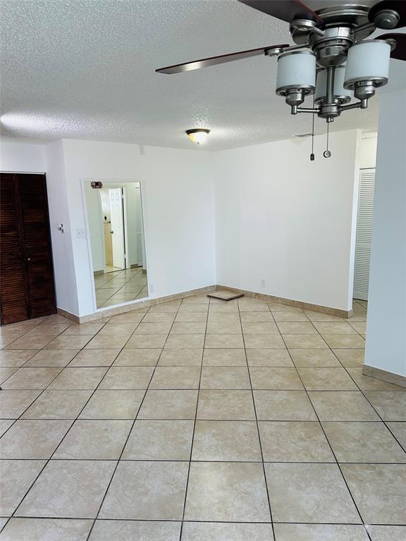 10046 Winding Lake Road, Unit 203 Sunrise, FL 33351 - Photo 5 of 31 a view of a livingroom with kitchen and entryway