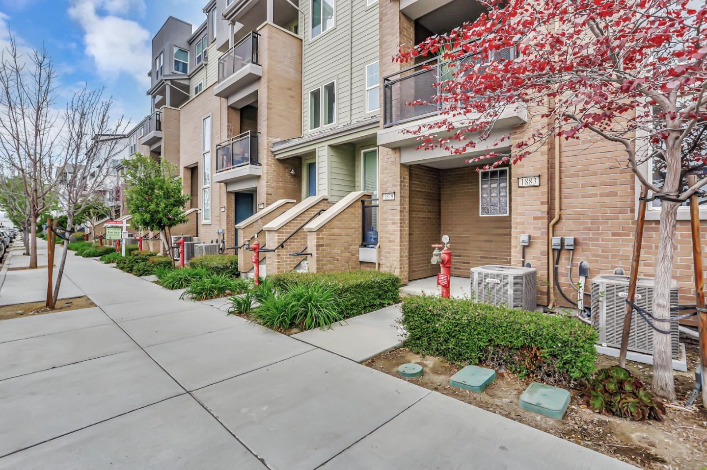 a front view of a building with garden