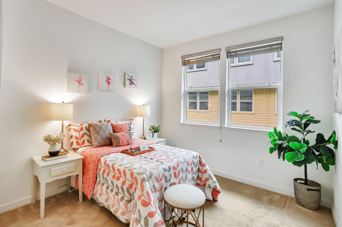 1883 Dobbin Drive San Jose, CA 95133 - Photo 12 of 27 a bedroom with a bed and a potted plant