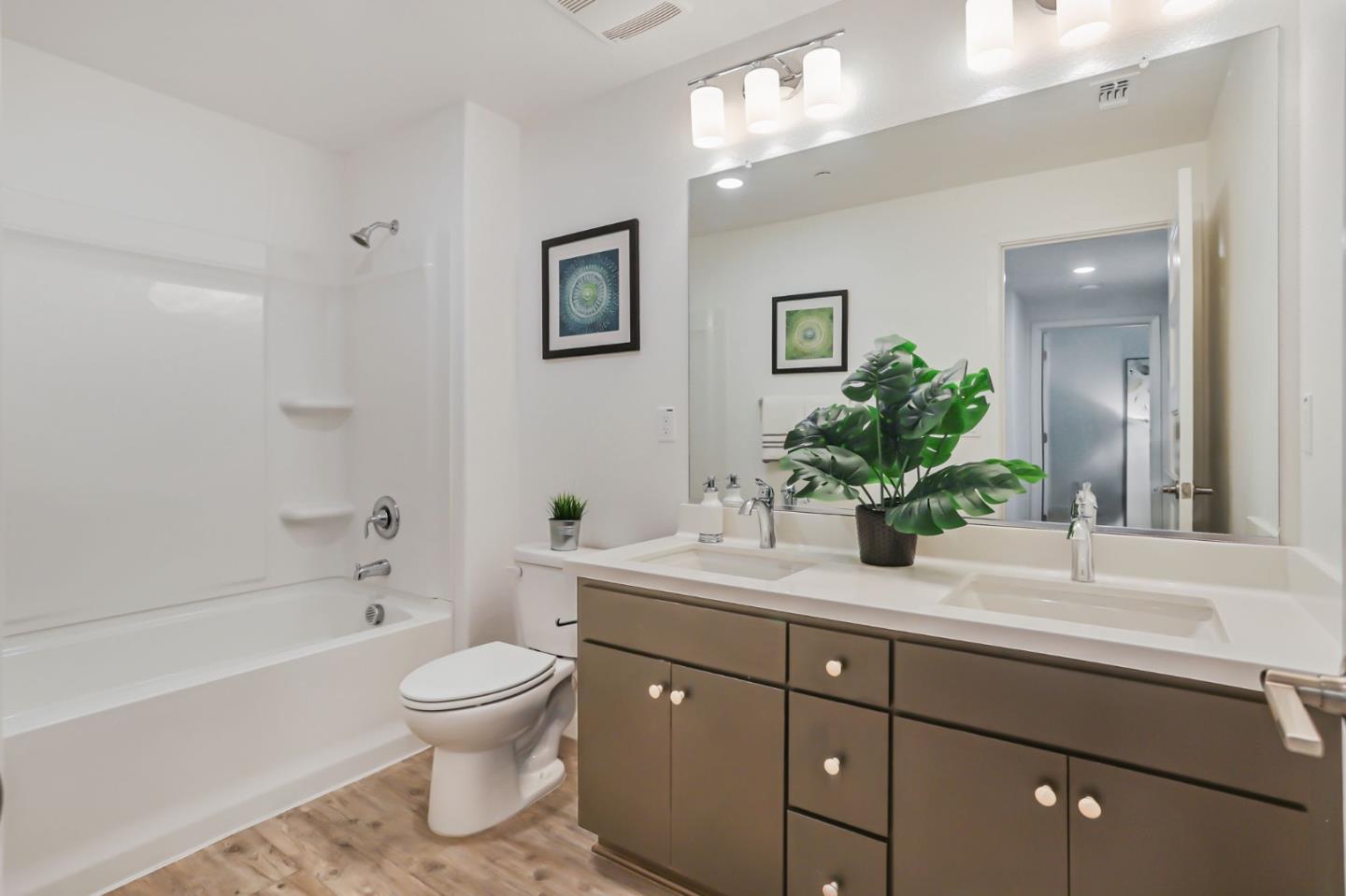 1883 Dobbin Drive San Jose, CA 95133 - Photo 14 of 27 a bathroom with a sink a toilet and a large mirror