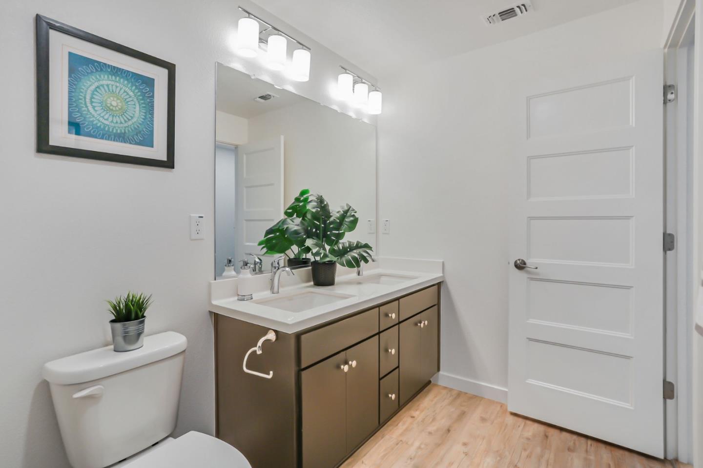 1883 Dobbin Drive San Jose, CA 95133 - Photo 15 of 27 a bathroom with a toilet a sink and a mirror
