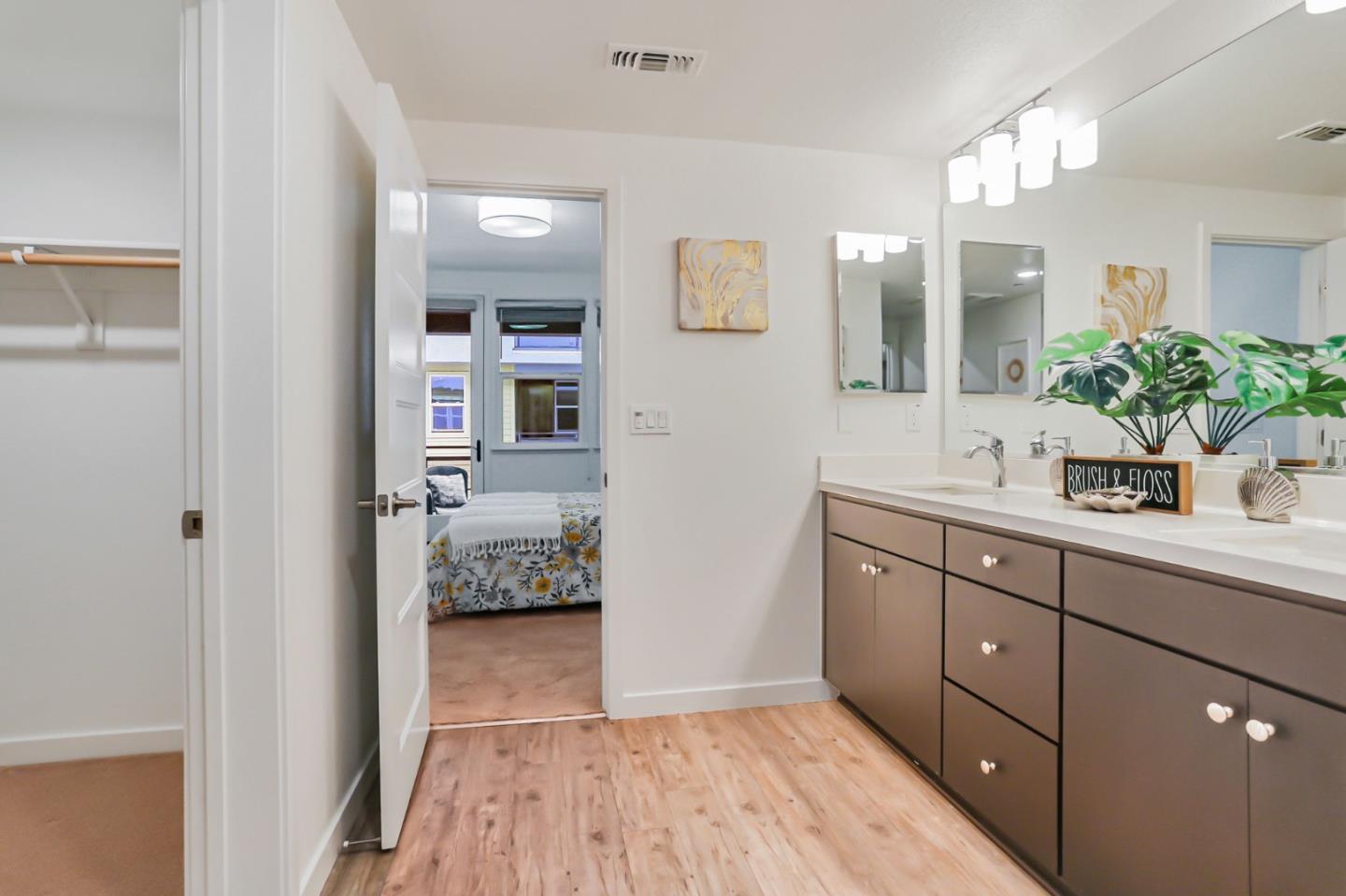1883 Dobbin Drive San Jose, CA 95133 - Photo 19 of 27 a spacious bathroom with a granite countertop sink a mirror and a shower