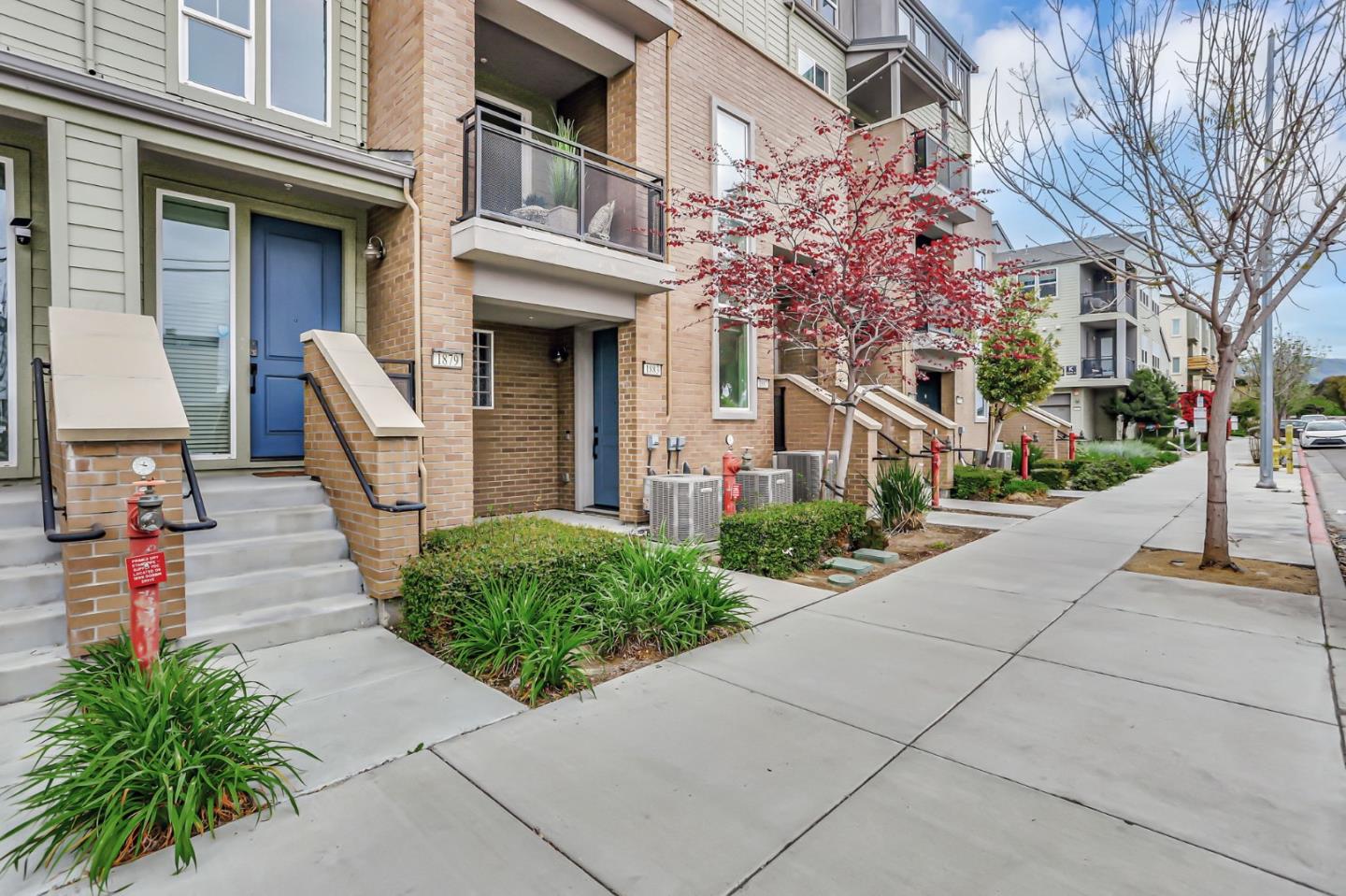 1883 Dobbin Drive San Jose, CA 95133 - Photo 3 of 27 a front view of a building with garden and seating area