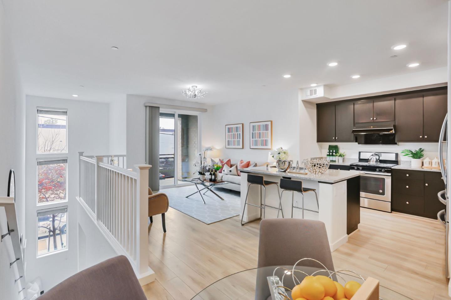 1883 Dobbin Drive San Jose, CA 95133 - Photo 6 of 27 a large kitchen with a table and chairs