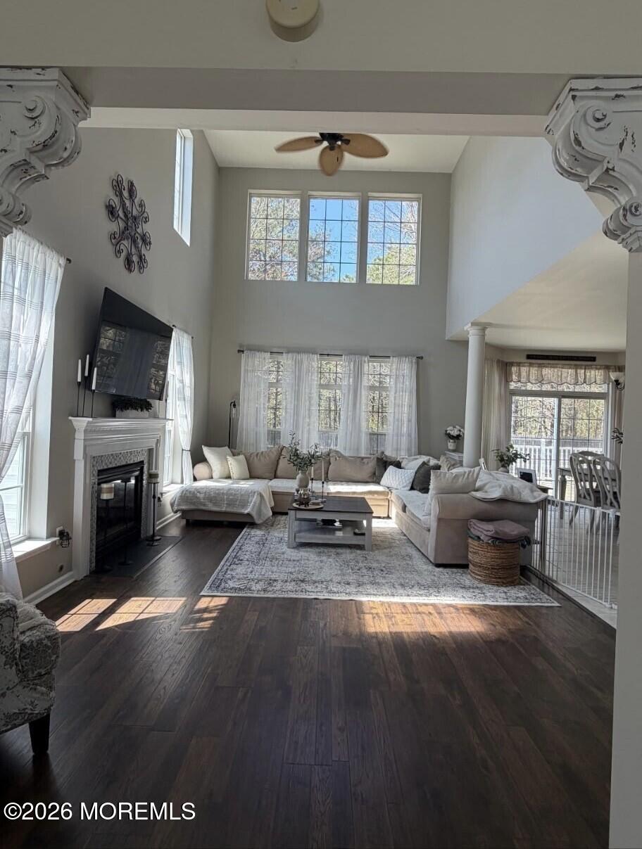 381 Leeward Road Manahawkin, NJ 08050 - Photo 12 of 17 a living room with furniture and a fireplace